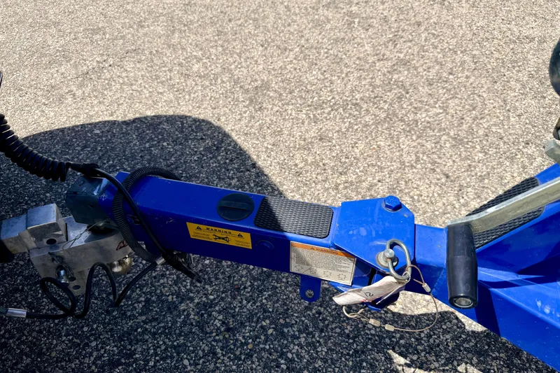Slide: The Image of Trailer hitch of a 2008 Moomba Outback V boat on asphalt surface. - 68