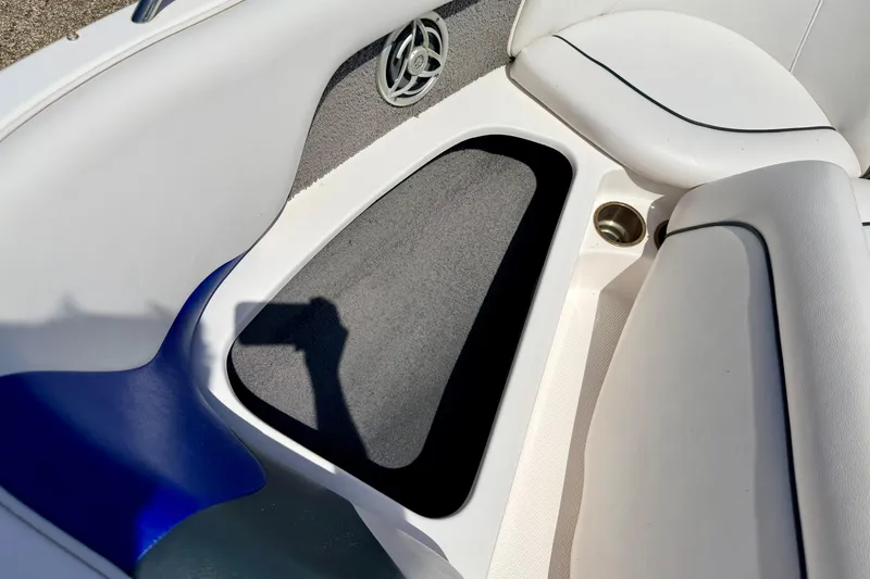 Slide: The Image of Interior of 2008 Moomba Outback V boat, featuring white seating and speaker detail. - 51