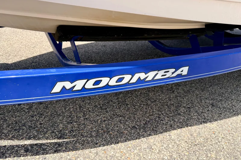 Slide: The Image of Blue Moomba Outback V 2008 boat trailer on pavement. - 65