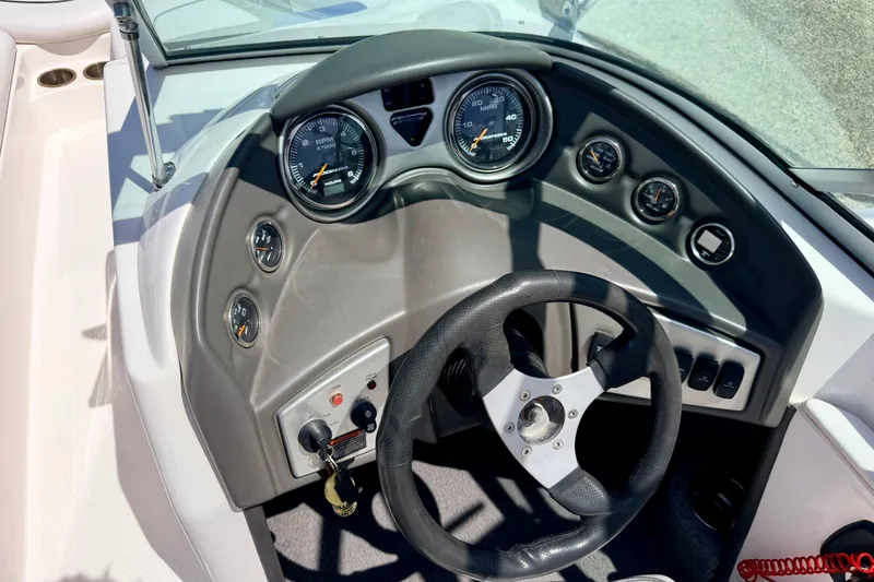 Slide: The Image of 2008 Moomba Outback V dashboard with steering wheel and gauges. - 37