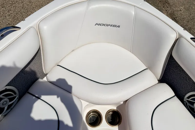 Slide: The Image of 2008 Moomba Outback V boat interior with white seating and cup holders. - 53