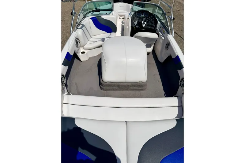 Slide: The Image of 2008 Moomba Outback V boat interior with white and blue seating, steering wheel, and dashboard. - 28