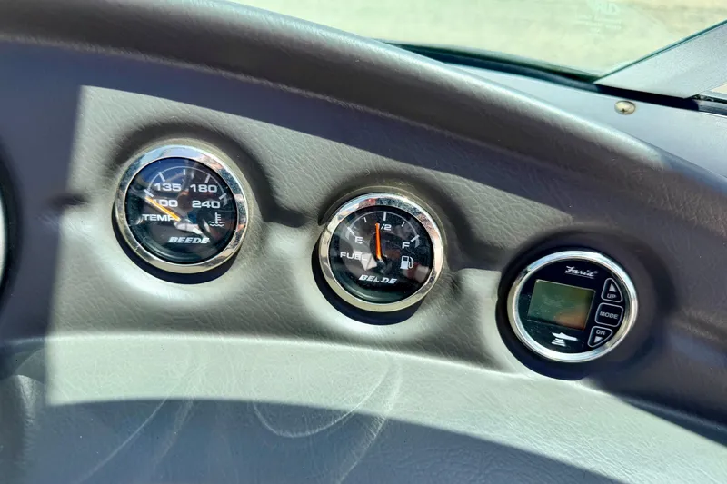 Slide: The Image of Dashboard gauges of a 2008 Moomba Outback V boat, showing temperature and fuel levels. - 39