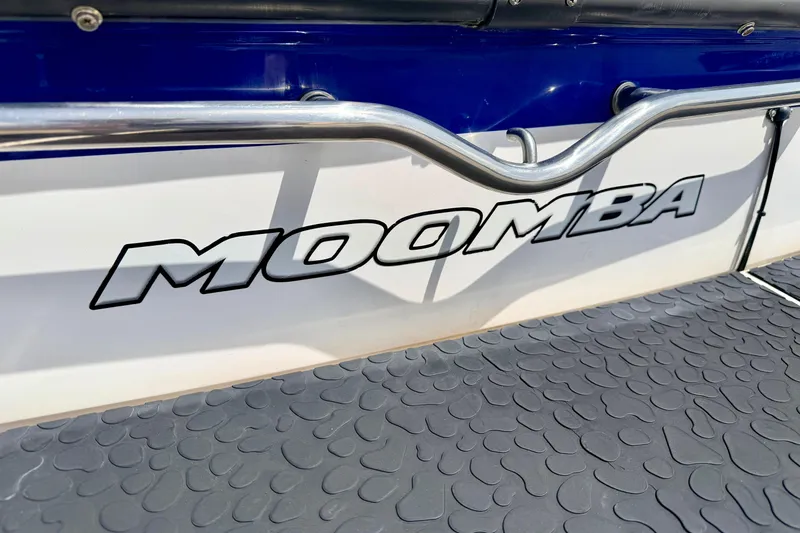Slide: The Image of 2008 Moomba Outback V boat with logo and textured flooring. - 14