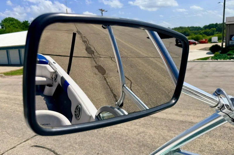 Slide: The Image of Rearview mirror reflection of a 2008 Moomba Outback V boat interior on a sunny day. - 59
