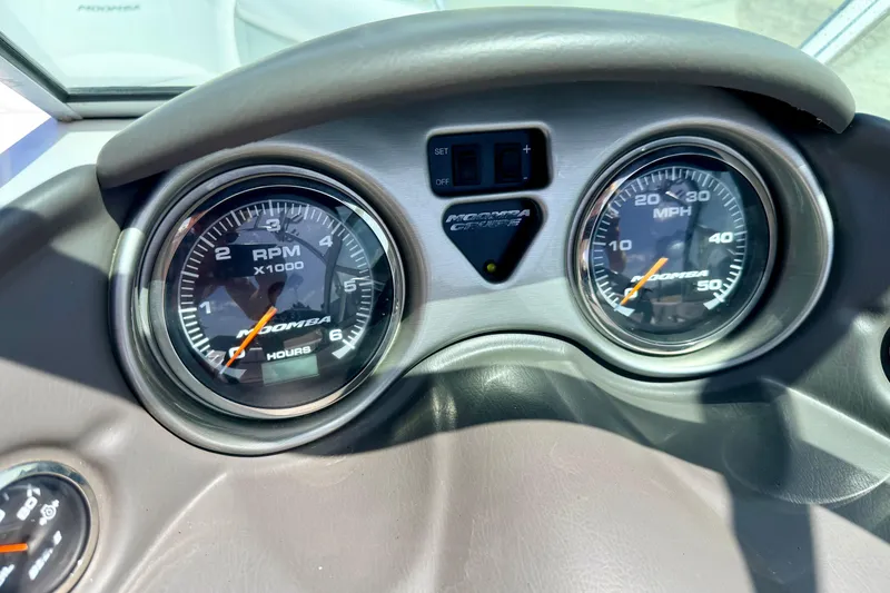 Slide: The Image of Dashboard of 2008 Moomba Outback V showing RPM and MPH gauges. - 38