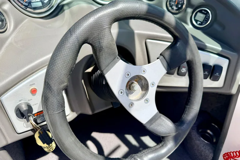 Slide: The Image of Steering wheel and dashboard of a 2008 Moomba Outback V boat. - 42