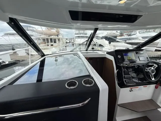 Slide: The Image of Interior view of a modern boat helm with steering wheel and instruments. - 20