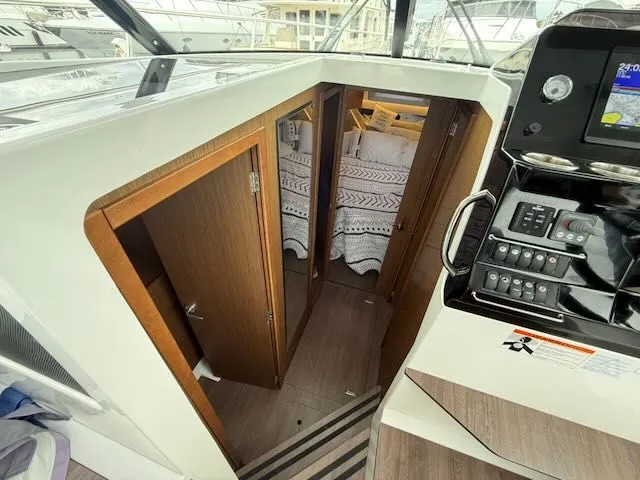 Slide: The Image of Interior of a Jeanneau NC 1095 with cabin and helm station. - 23
