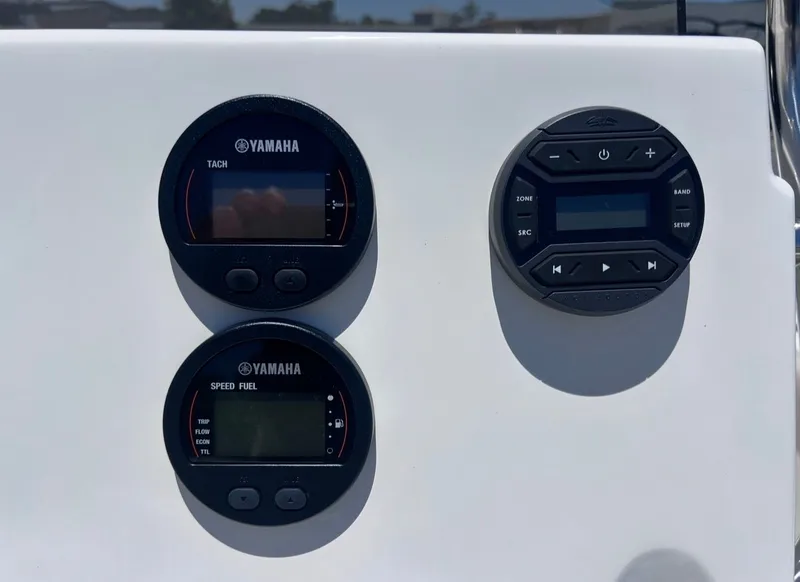 Slide: The Image of Three round instruments on a white boat panel, including a tachometer and speedometer. - 13