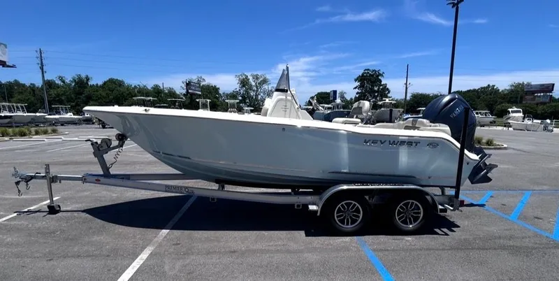 Slide: The Image of Key West 203 FS boat parked on a trailer outdoors. - 7