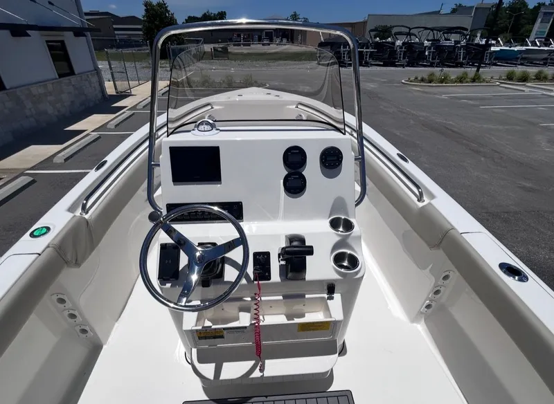 Slide: The Image of The image shows the cockpit of a 2026 Key West 203 FS boat with steering and instruments. - 11