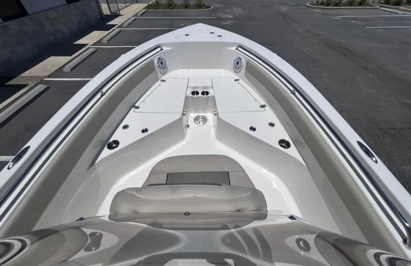 Slide: The Image of The image shows the deck of a Key West 203 FS boat parked in a lot. - 10