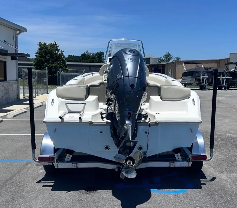 Slide: The Image of A 2026 Key West 203 FS boat on a trailer. It features an outboard motor. - 5