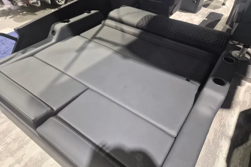 Slide: The Image of 2026 Sylvan L3 ULZ boat interior with sleek gray seating and integrated cup holders. - 27
