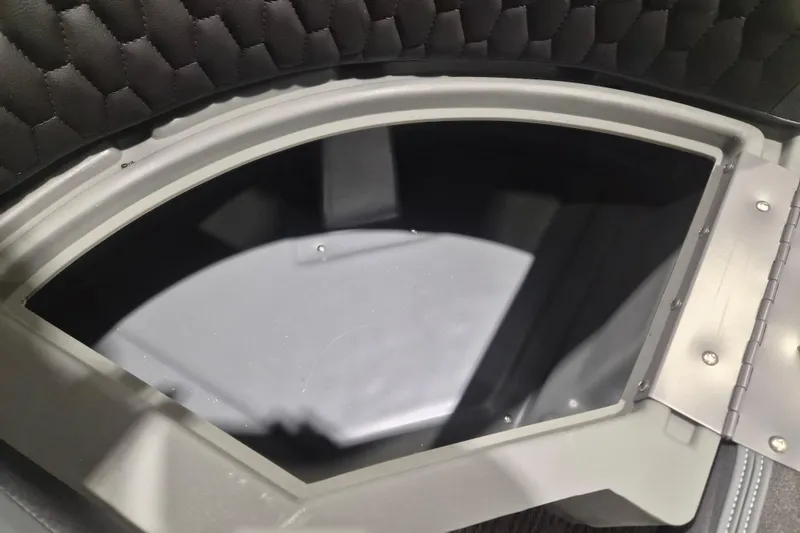 Slide: The Image of Interior view of a 2026 Sylvan L3 ULZ boat storage compartment with quilted lining. - 6