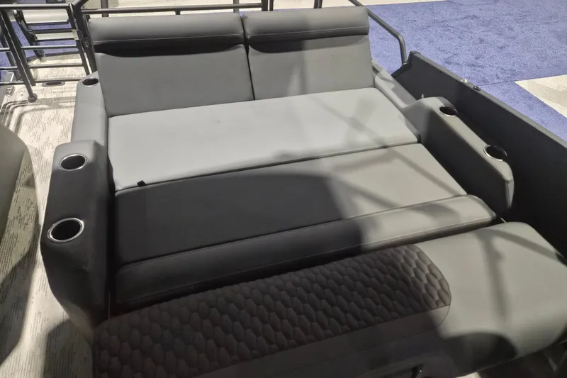 Slide: The Image of 2026 Sylvan L3 ULZ boat seating with cup holders, featuring sleek gray upholstery. - 26