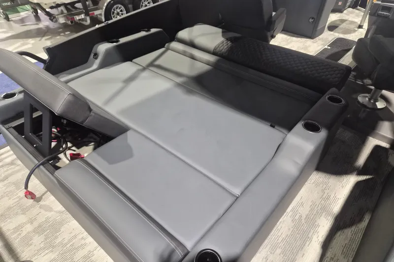 Slide: The Image of 2026 Sylvan L3 ULZ boat interior with gray seating and cup holders. - 14