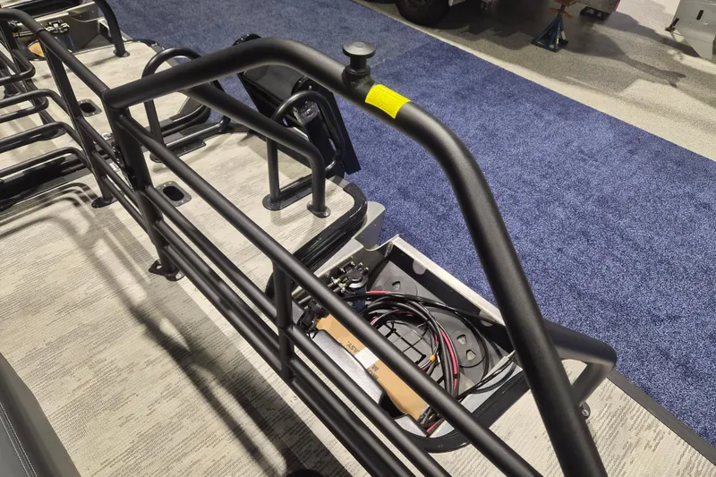 Slide: The Image of 2026 Sylvan L3 ULZ boat interior with metal railings and exposed wiring. - 18