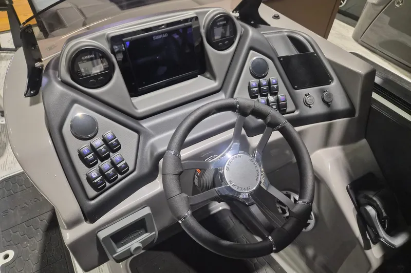 Slide: The Image of Steering console of 2026 Sylvan L3 ULZ boat with advanced controls and display. - 24