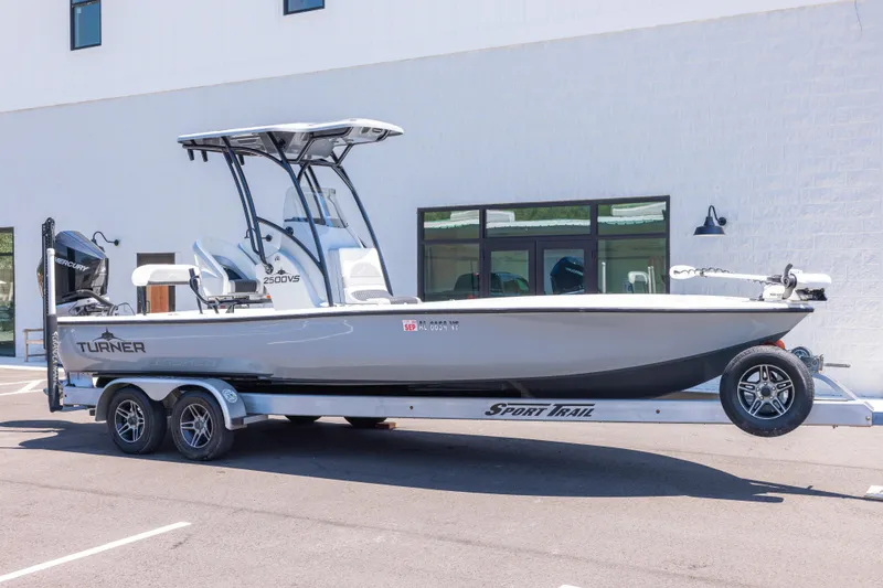 The Image of 2020 Turner Boatworks 2500 VS on trailer, parked outdoors near a building. - 1