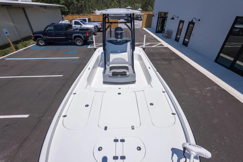 Slide: The Image of 2020 Turner Boatworks 2500 VS in parking lot, showcasing sleek design and spacious deck. - 12