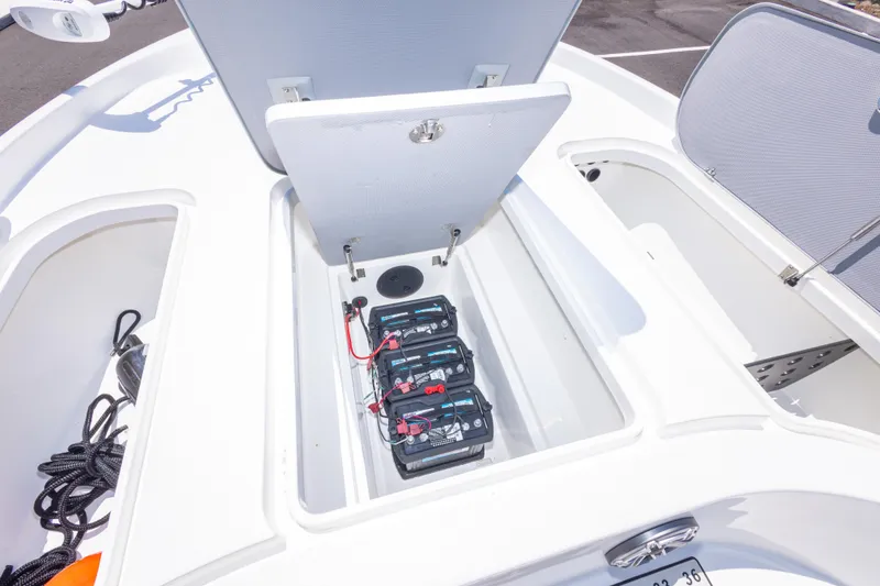 Slide: The Image of 2020 Turner Boatworks 2500 VS battery compartment with multiple batteries and storage space. - 14