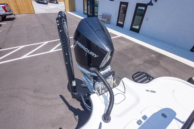 Slide: The Image of Turner Boatworks 2500 VS 2020 model with Mercury engine in parking lot. - 20