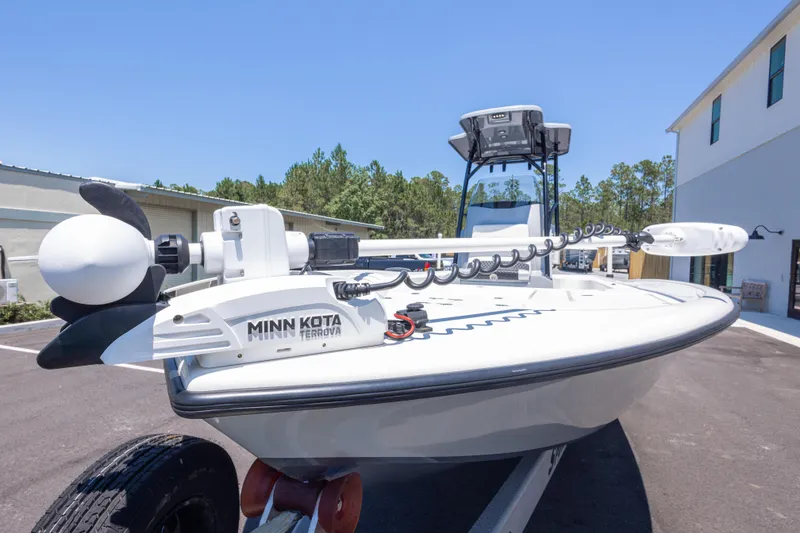 Slide: The Image of 2020 Turner Boatworks 2500 VS with Minn Kota Terrova motor, parked outdoors. - 7