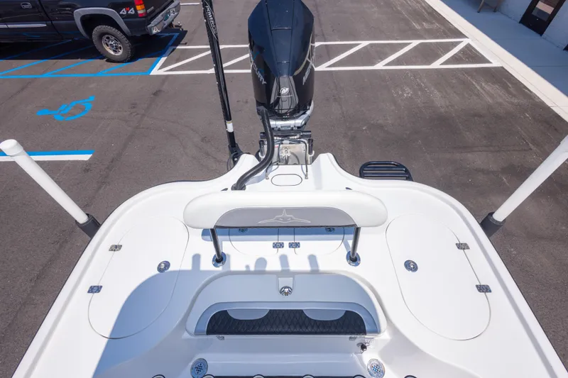 Slide: The Image of 2020 Turner Boatworks 2500 VS with Mercury outboard motor in parking lot. - 16