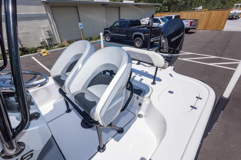 Slide: The Image of 2020 Turner Boatworks 2500 VS with dual seats and Mercury engine in a parking lot. - 15