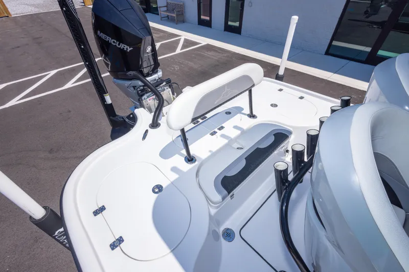 Slide: The Image of 2020 Turner Boatworks 2500 VS with Mercury engine, featuring sleek white deck and seating. - 17