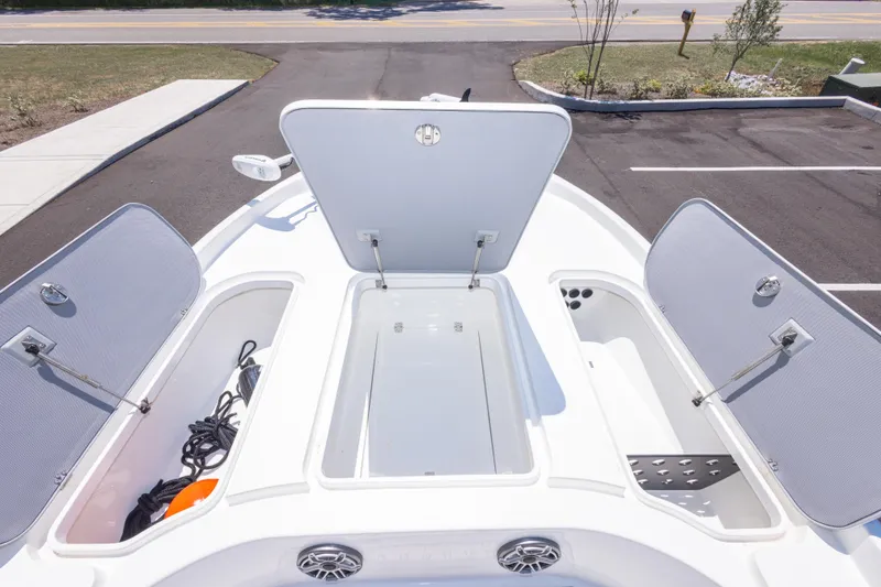 Slide: The Image of 2020 Turner Boatworks 2500 VS with open storage compartments, showcasing spacious deck design. - 13