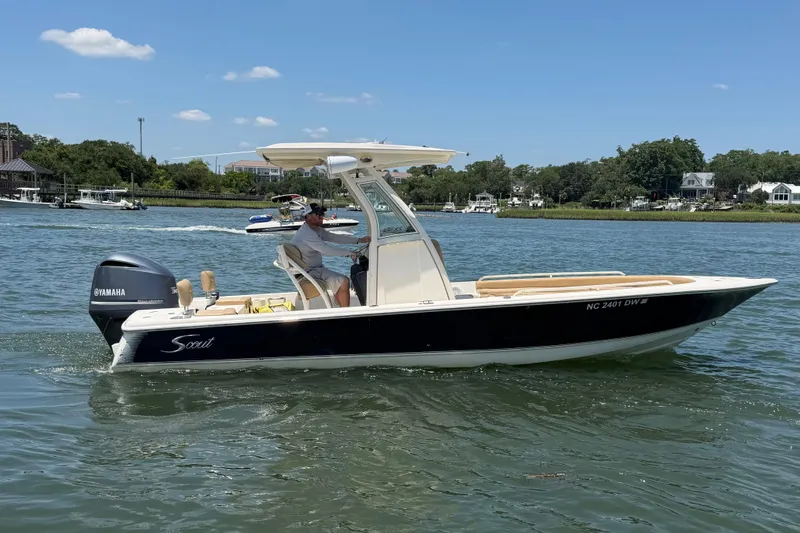 Slide: The Image of 2012 Scout 251 XS boat cruising on a sunny day with Yamaha engine. - 11