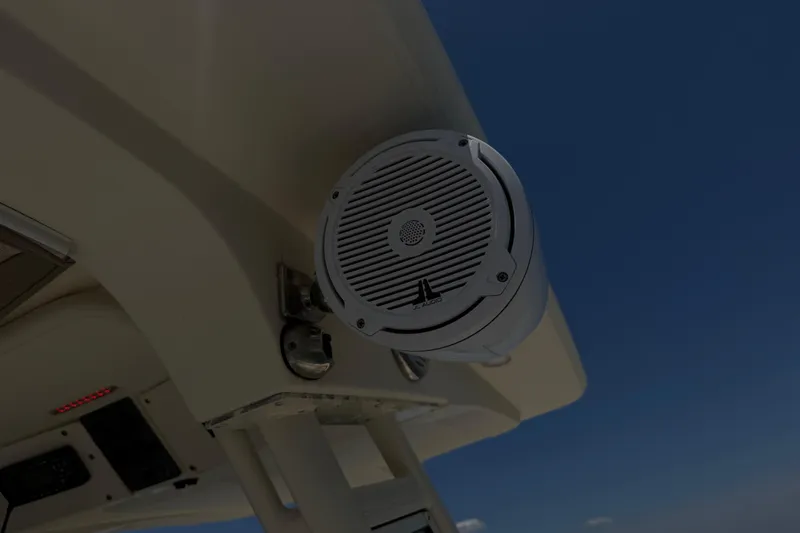 Slide: The Image of Speaker mounted on a 2012 Scout 251 XS boat against a clear blue sky. - 20