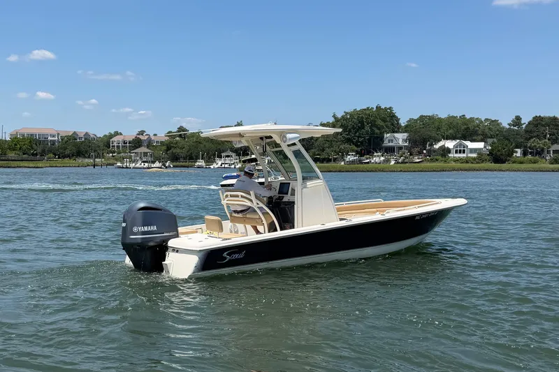 Slide: The Image of 2012 Scout 251 XS boat with Yamaha engine cruising on a sunny day. - 13