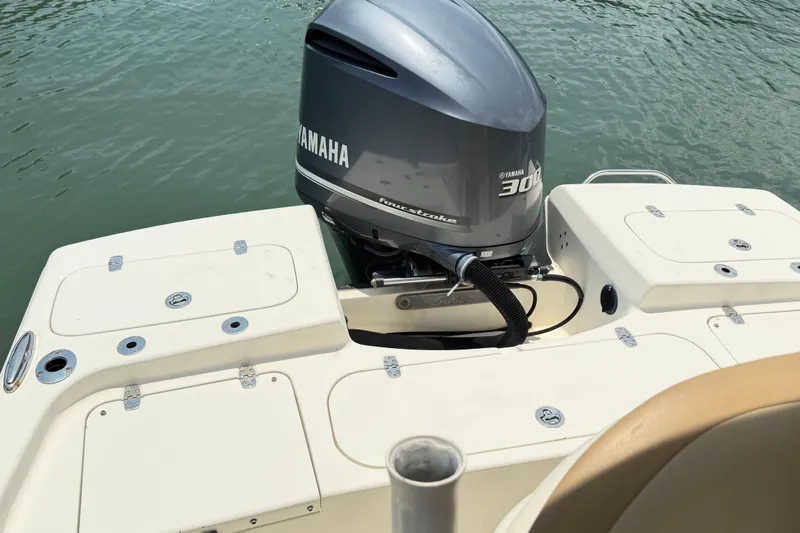 Slide: The Image of 2012 Scout 251 XS boat with Yamaha 300 outboard motor on calm water. - 6