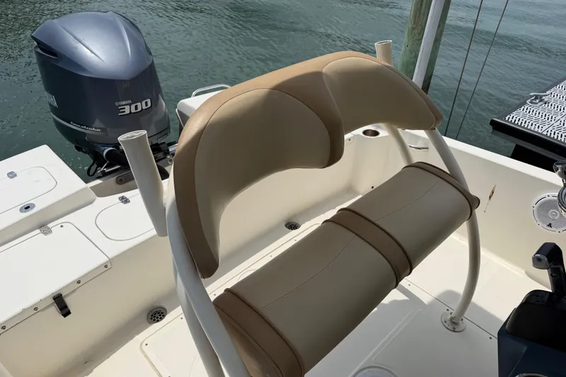 Slide: The Image of 2012 Scout 251 XS boat interior with Yamaha 300 engine, featuring tan seating. - 8