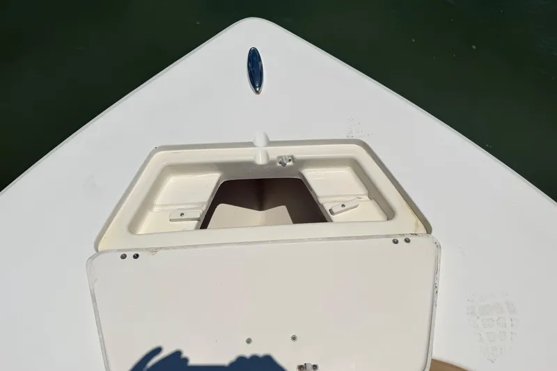 Slide: The Image of Bow storage compartment on a 2012 Scout 251 XS boat, open and empty. - 17