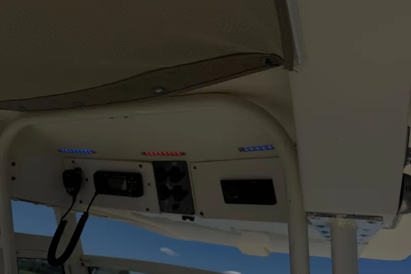 Slide: The Image of Interior view of 2012 Scout 251 XS boat console with radio and LED lights. - 21