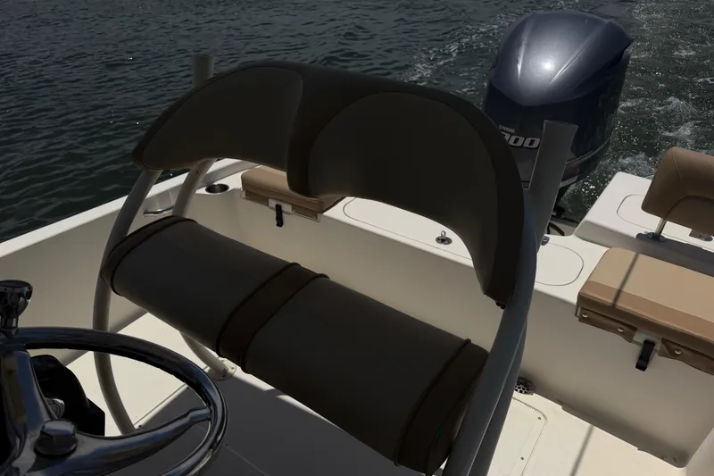 Slide: The Image of 2012 Scout 251 XS boat interior with seating and Yamaha outboard motor. - 23