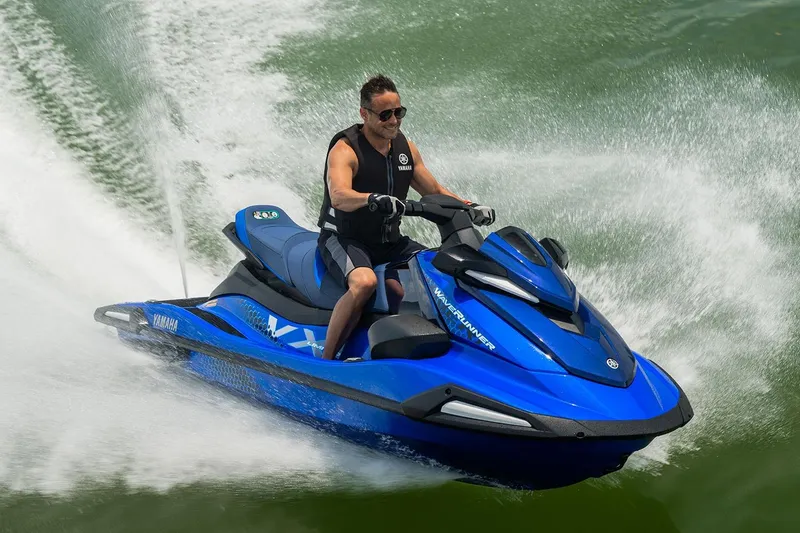Slide: The Image of Manufacturer Provided Image: Man riding 2026 Yamaha WaveRunner VX Limited on water, creating dynamic splashes. - 2