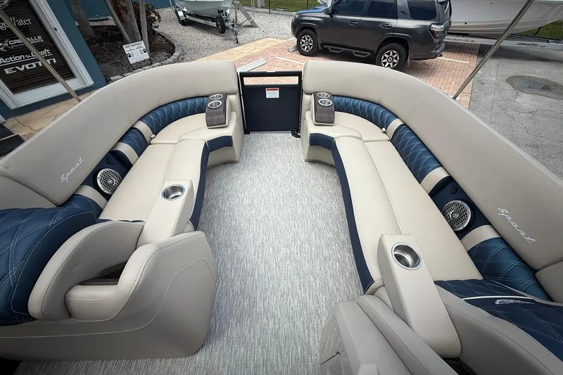 Slide: The Image of Luxurious interior of 2026 Bennington 27 QSBAT2 pontoon boat with plush seating and cup holders. - 19