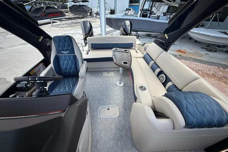 Slide: The Image of Luxurious interior of 2026 Bennington 27 QSBAT2 pontoon boat with plush seating and modern design. - 15