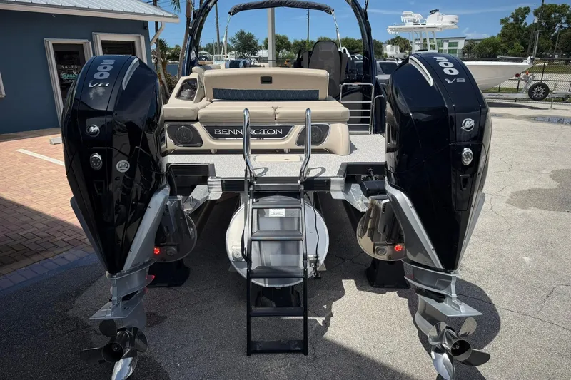 Slide: The Image of 2026 Bennington 27 QSBAT2 boat with dual 300 V8 engines, rear view. - 2
