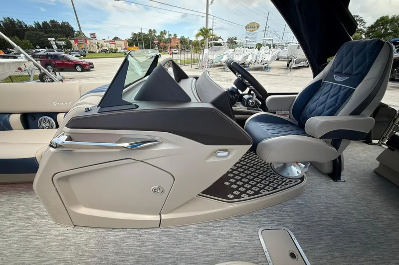 Slide: The Image of Luxurious interior of 2026 Bennington 27 QSBAT2 pontoon boat with plush seating and modern dashboard. - 17