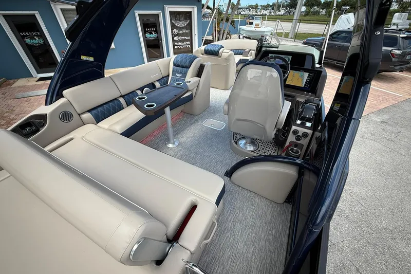 Slide: The Image of Luxurious interior of 2026 Bennington 27 QSBAT2 pontoon boat with plush seating and modern helm. - 9