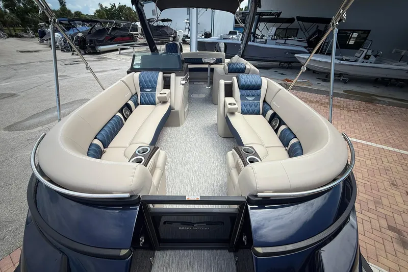 Slide: The Image of Luxurious 2026 Bennington 27 QSBAT2 pontoon boat with plush seating and modern design. - 20