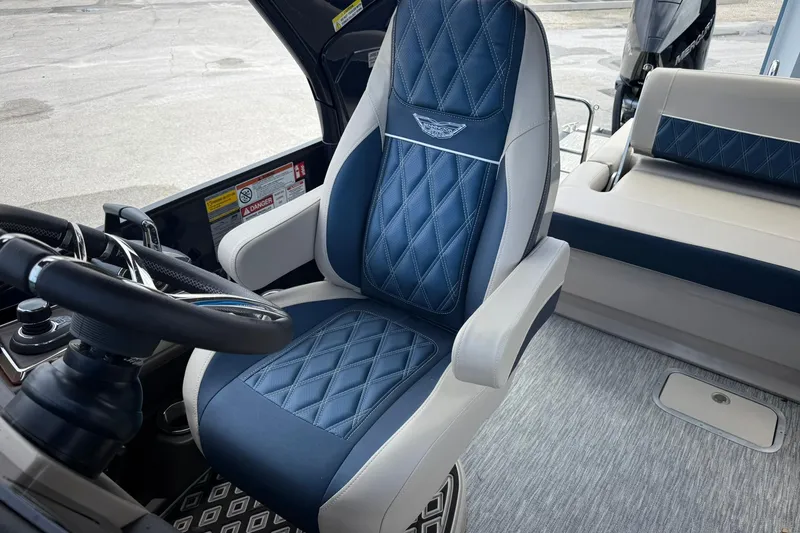 Slide: The Image of Luxury seating in 2026 Bennington 27 QSBAT2 boat, featuring diamond-stitched upholstery and modern design. - 16