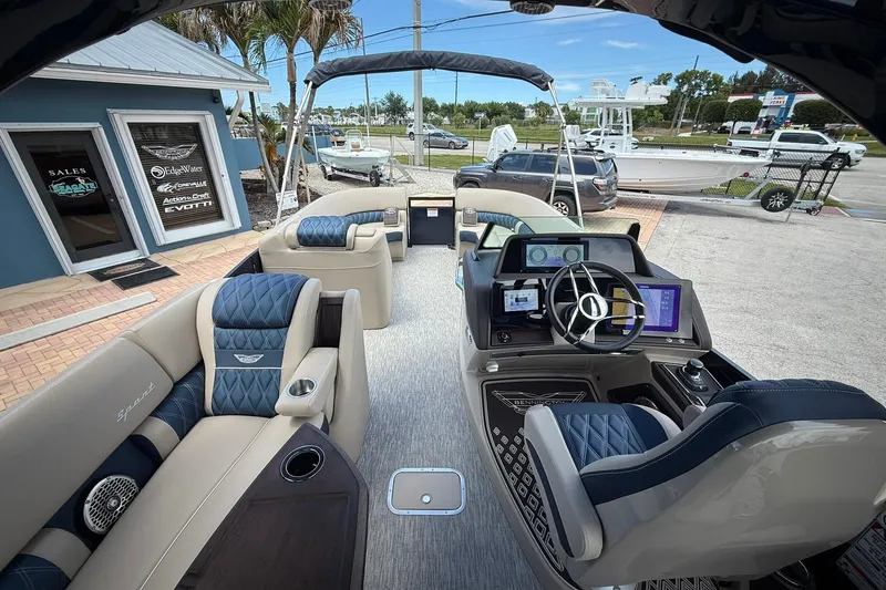 Slide: The Image of Interior of 2026 Bennington 27 QSBAT2 pontoon boat with luxurious seating and modern helm. - 11